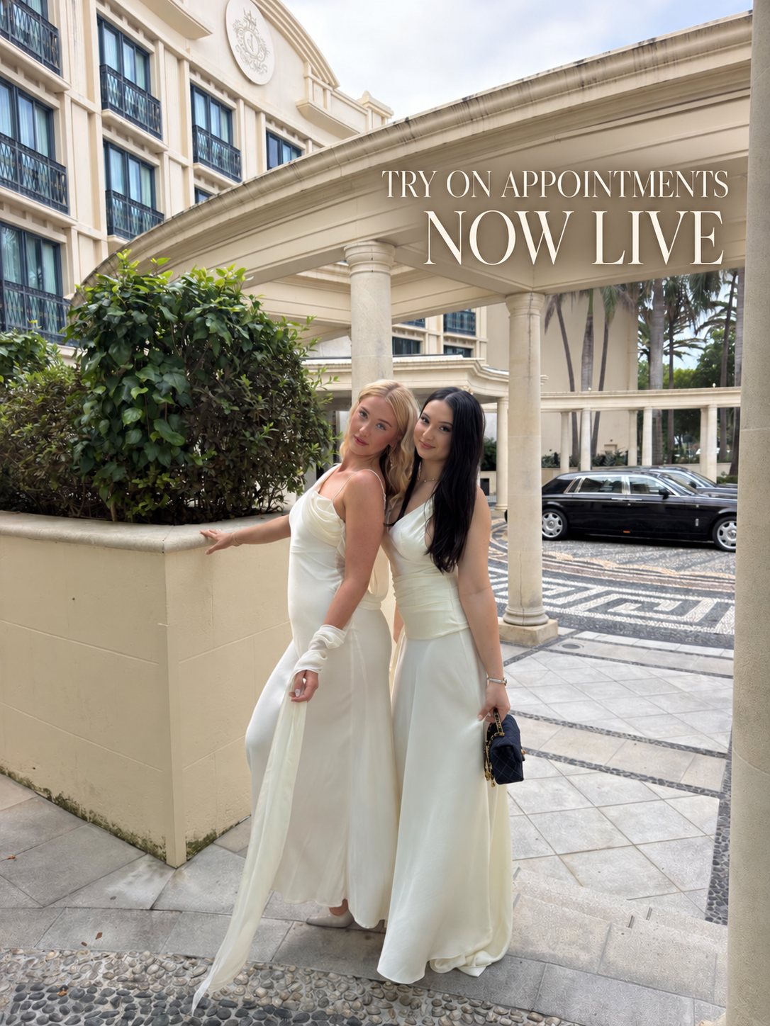 Two women wearing elegant white gowns at a luxury hotel — Try On Appointments Now Live